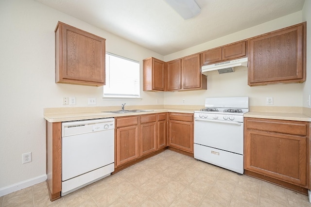 kitchen featuring white appliances and sink