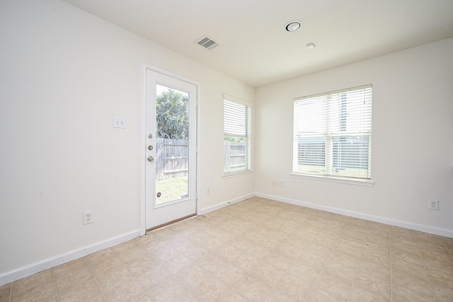 unfurnished room with a wealth of natural light