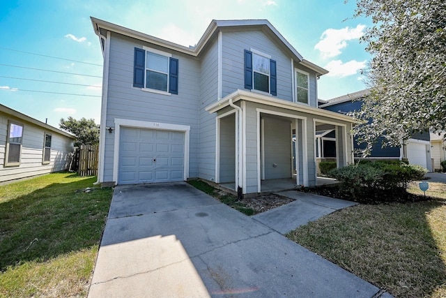 view of front property featuring a garage and a front yard