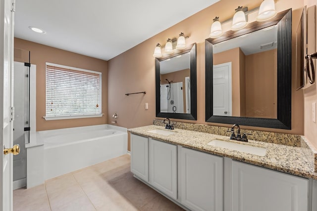 bathroom with vanity, independent shower and bath, and tile patterned flooring