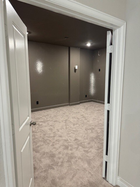 16147 Rustling Woods Rd, Conroe, TX 77302 - hall featuring carpet flooring and baseboards