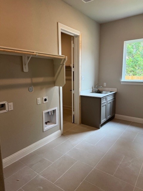 16147 Rustling Woods Rd, Conroe, TX 77302 - laundry area featuring hookup for an electric dryer, baseboards, washer hookup, and gas dryer hookup