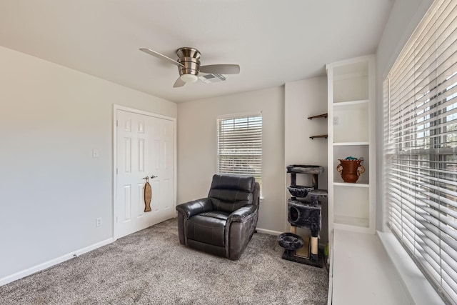 sitting room featuring carpet floors and ceiling fan