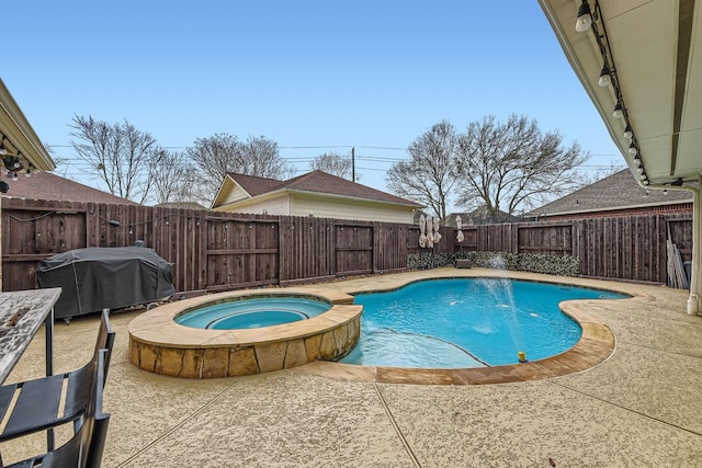 view of swimming pool featuring pool water feature, area for grilling, an in ground hot tub, and a patio area