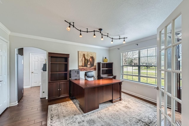 office area with crown molding, dark wood-type flooring, and a textured ceiling