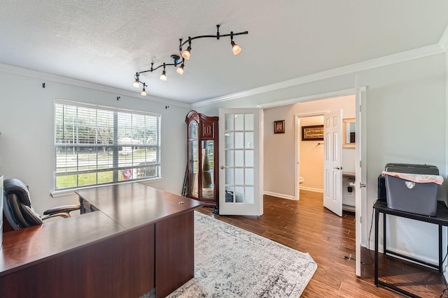 office area featuring hardwood / wood-style flooring, rail lighting, french doors, a textured ceiling, and ornamental molding