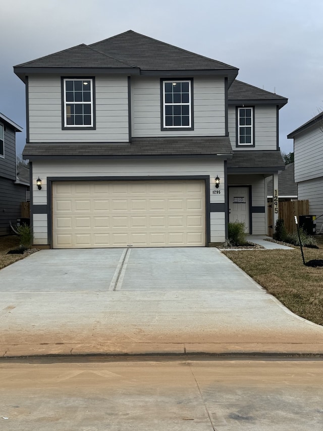 front of property with a garage