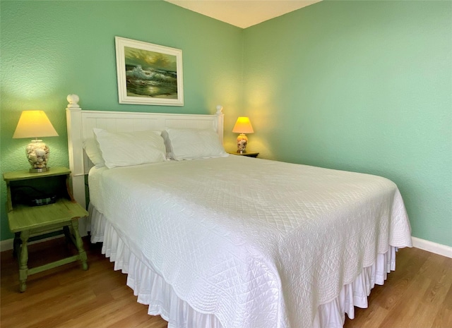 bedroom featuring hardwood / wood-style flooring