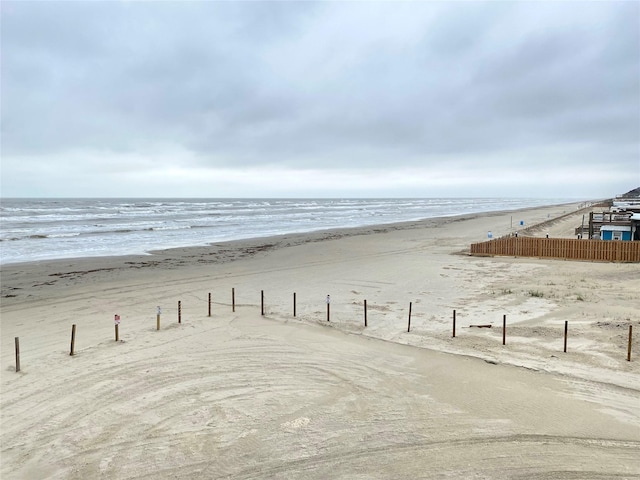 property view of water featuring a beach view