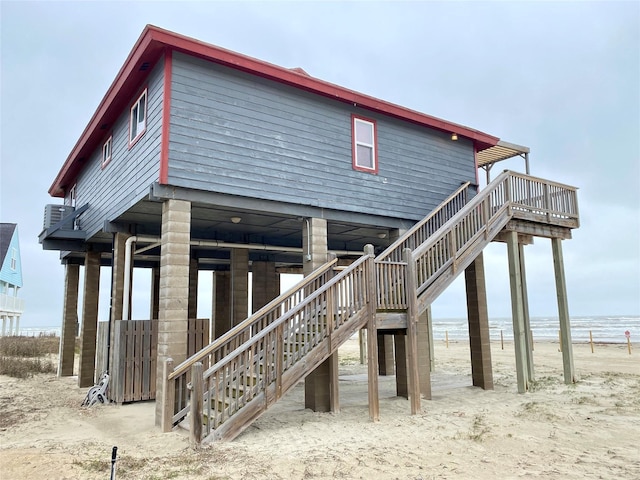 back of property with a water view