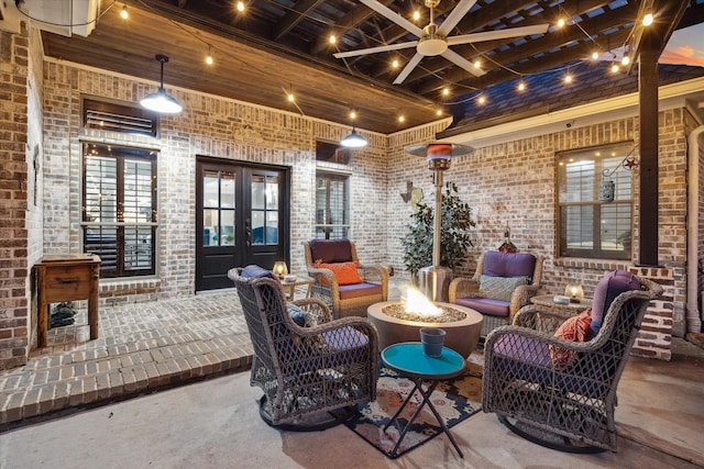 view of patio / terrace featuring french doors and an outdoor fire pit