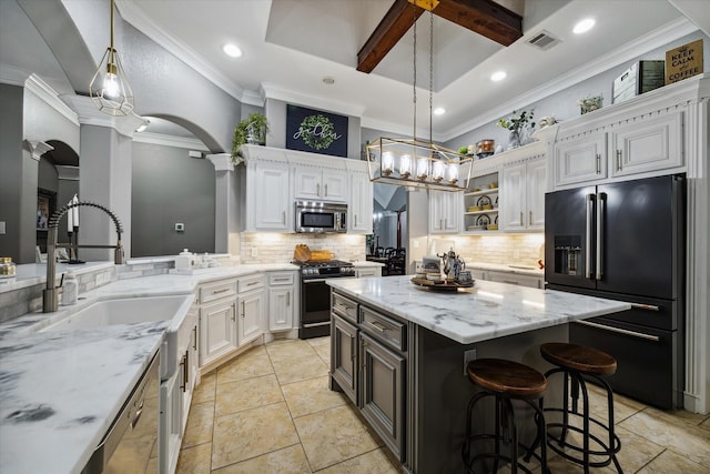 kitchen with light stone counters, open shelves, visible vents, appliances with stainless steel finishes, and white cabinets