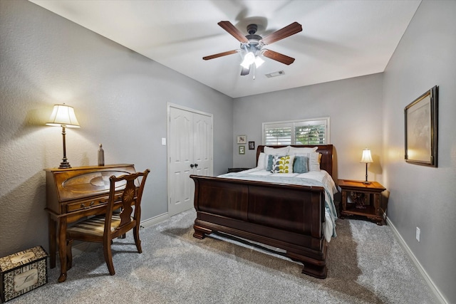 bedroom featuring a closet, visible vents, a ceiling fan, carpet flooring, and baseboards