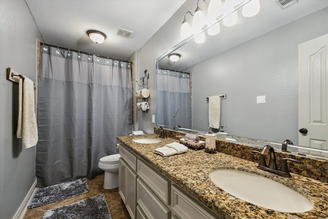 full bathroom with toilet, visible vents, and a sink