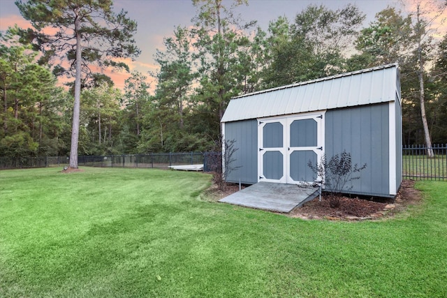 view of shed featuring fence