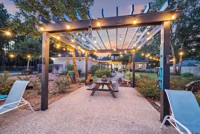 view of patio / terrace featuring fence and a pergola