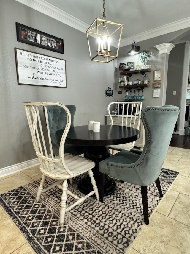 dining room with baseboards, ornamental molding, and a notable chandelier