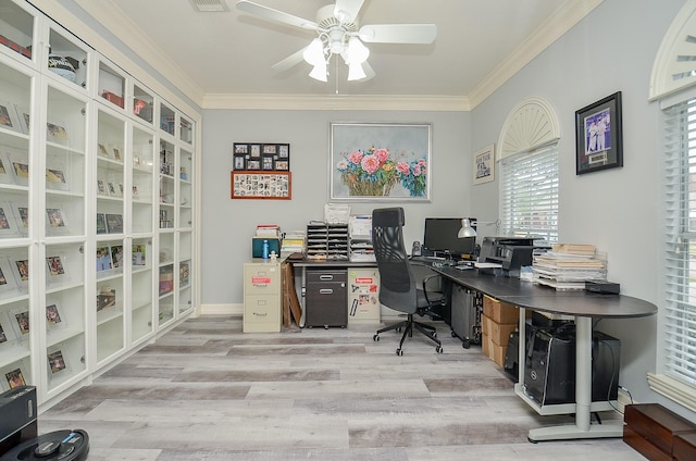 office space with ornamental molding, light hardwood / wood-style floors, and ceiling fan