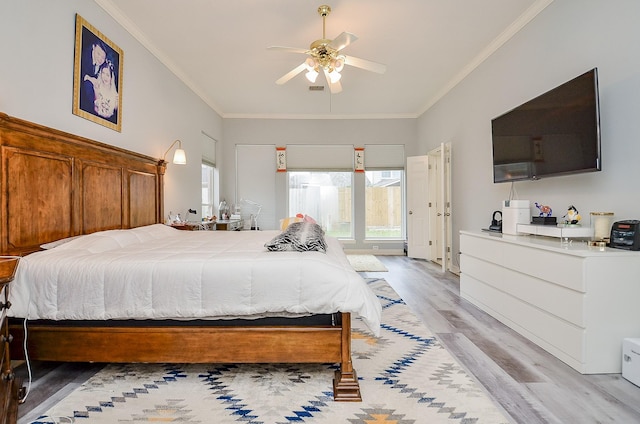 bedroom with light hardwood / wood-style flooring, ornamental molding, and ceiling fan