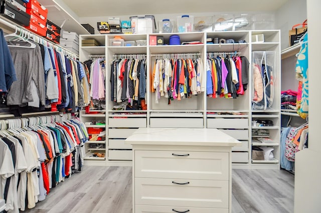 spacious closet featuring light hardwood / wood-style floors