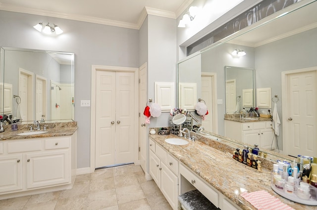 bathroom with crown molding, tile patterned floors, vanity, and walk in shower