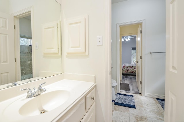 bathroom featuring vanity, tile patterned floors, and toilet