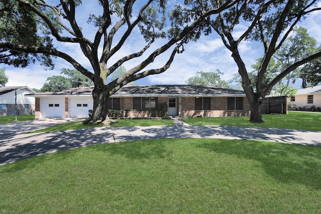 single story home with a garage and a front yard