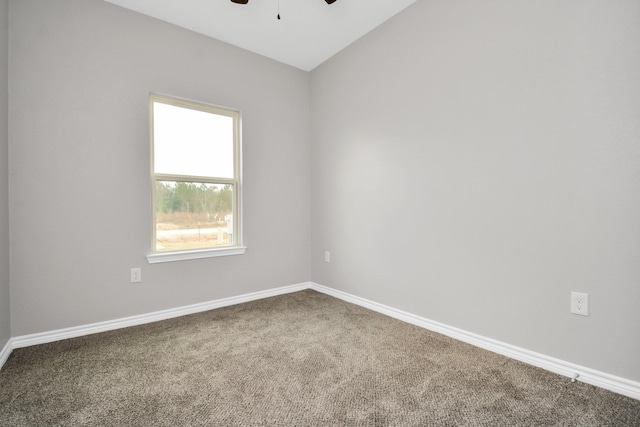 unfurnished room with vaulted ceiling, carpet floors, and ceiling fan