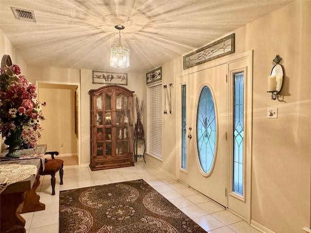 125 Clear Spgs, Trinity, TX 75862 - entrance foyer featuring tile patterned flooring, a chandelier, and baseboards