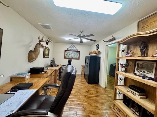 125 Clear Spgs, Trinity, TX 75862 - office area with a textured ceiling, wood finished floors, and a ceiling fan