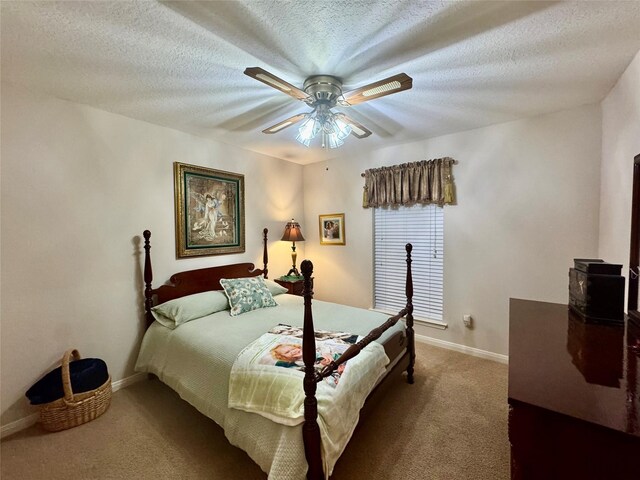 125 Clear Spgs, Trinity, TX 75862 - carpeted bedroom featuring baseboards, a ceiling fan, and a textured ceiling