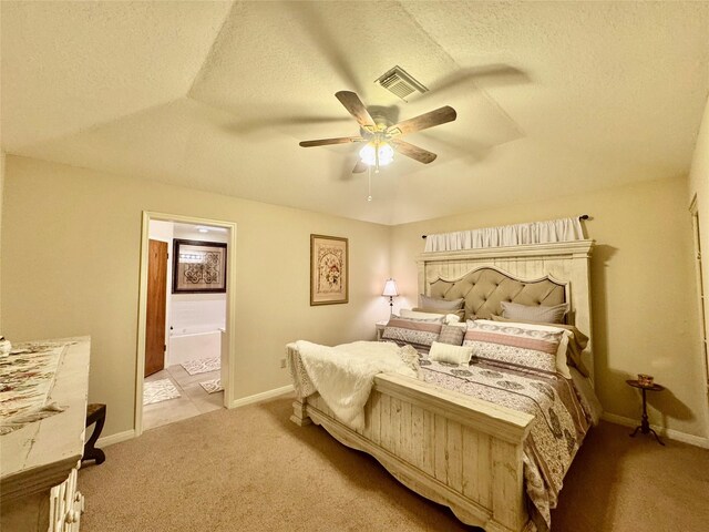125 Clear Spgs, Trinity, TX 75862 - bedroom with carpet, ceiling fan, a textured ceiling, ensuite bathroom, and baseboards