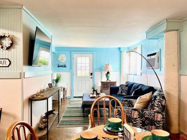 living room featuring a wall unit AC