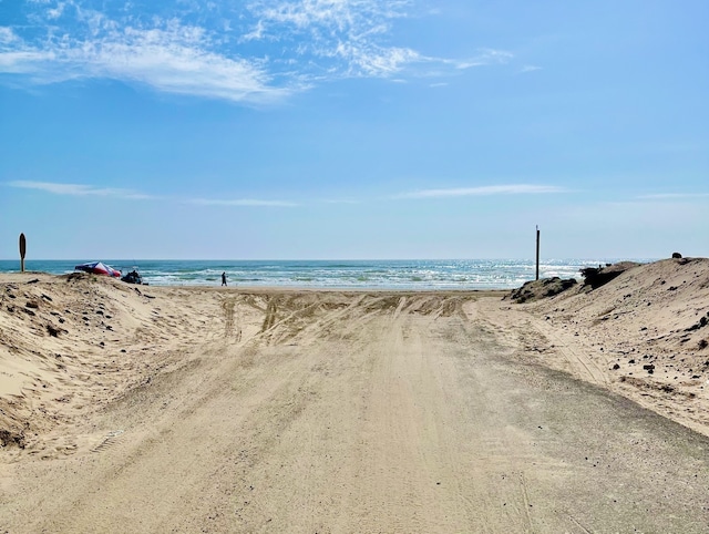 property view of water featuring a beach view