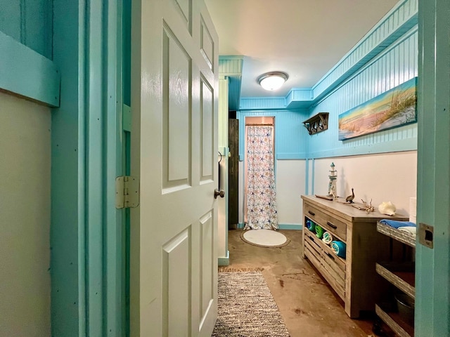 hallway with concrete floors