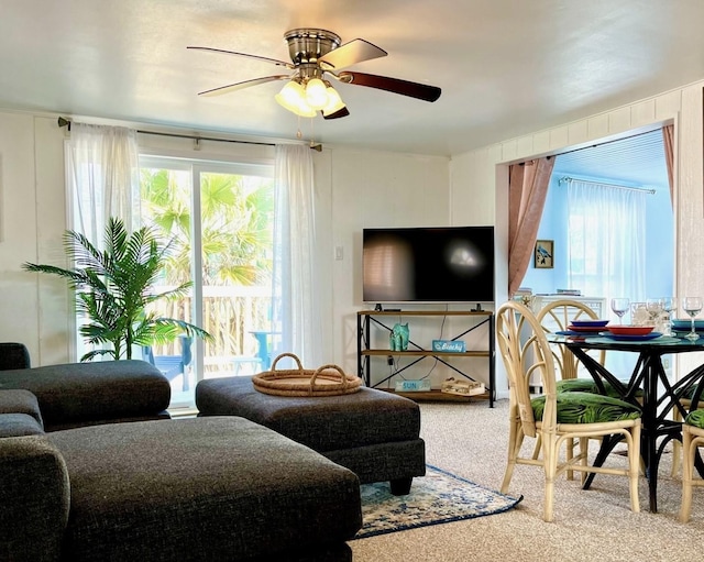 living room with ceiling fan, a healthy amount of sunlight, and carpet flooring