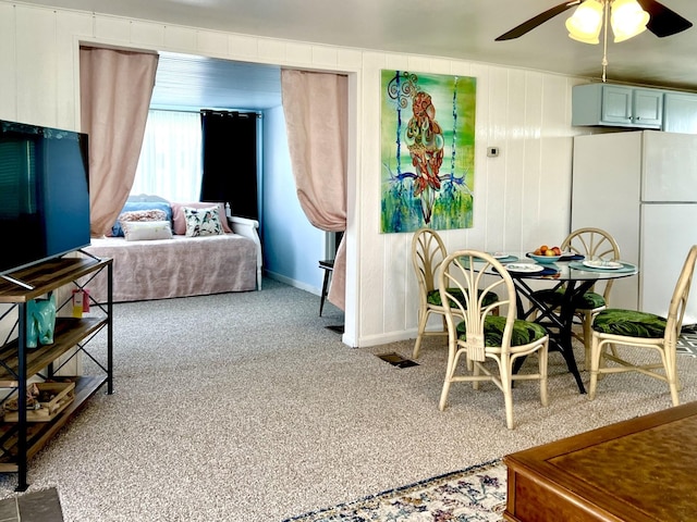 interior space featuring ceiling fan and white fridge