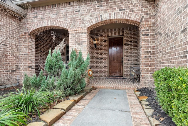 property entrance with brick siding