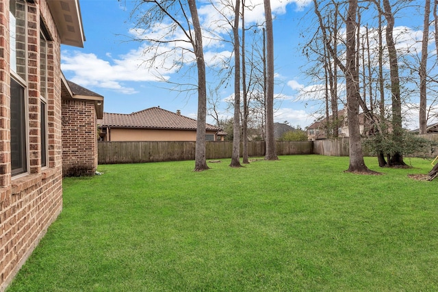 view of yard featuring a fenced backyard