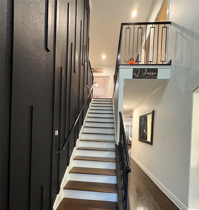 staircase featuring hardwood / wood-style flooring