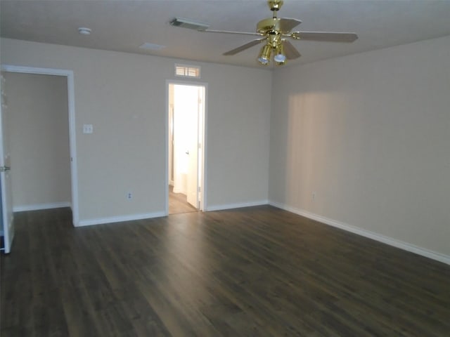 unfurnished room featuring dark hardwood / wood-style floors and ceiling fan