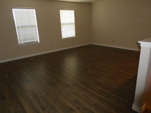 unfurnished room featuring dark hardwood / wood-style floors