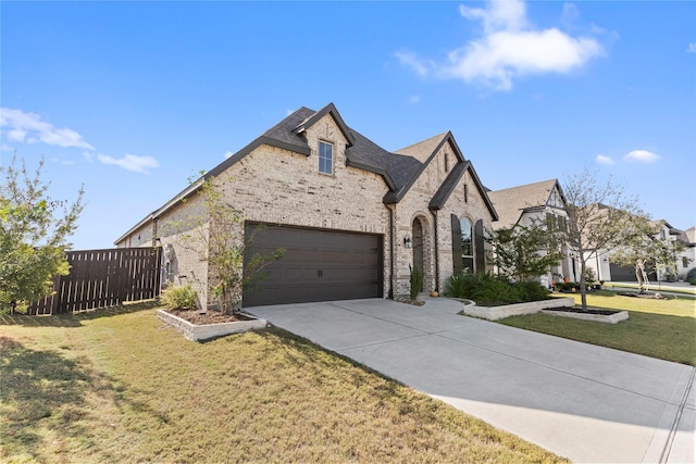 view of front facade with a garage and a front lawn