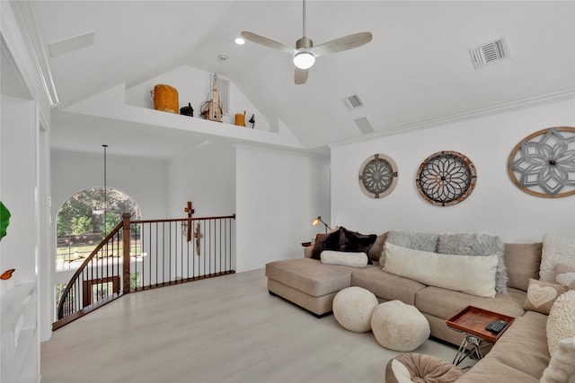 living room featuring crown molding, ceiling fan, high vaulted ceiling, and hardwood / wood-style floors