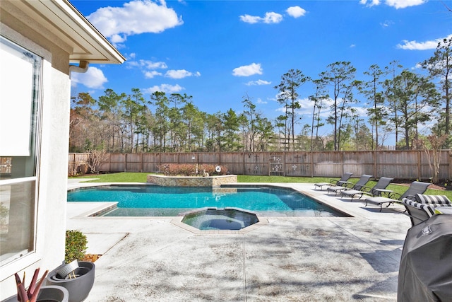 view of swimming pool featuring area for grilling, a patio, and an in ground hot tub