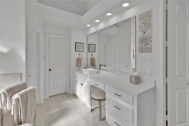 bathroom with hardwood / wood-style flooring and vanity