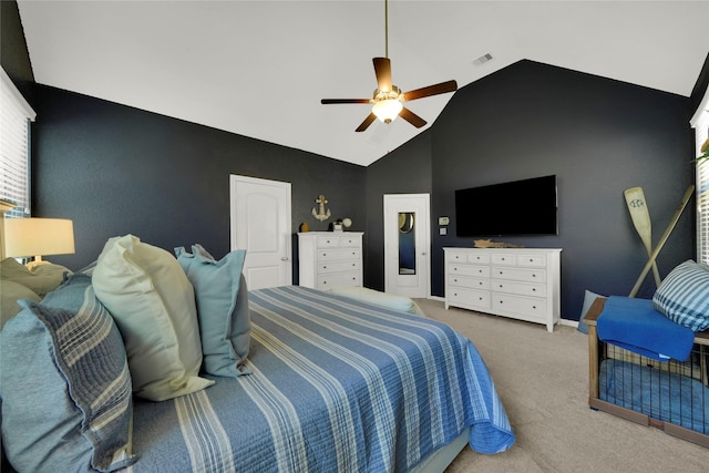 carpeted bedroom featuring high vaulted ceiling, ceiling fan, visible vents, and baseboards