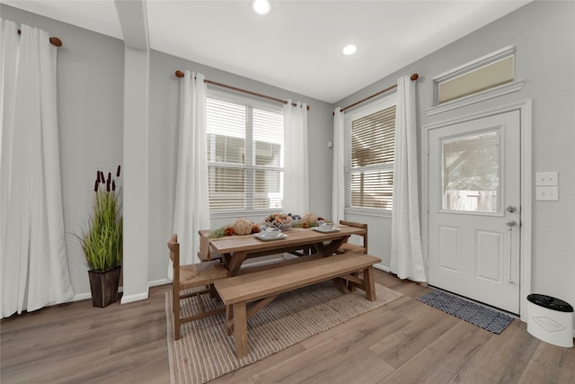 dining space featuring breakfast area, recessed lighting, light wood-style flooring, and baseboards