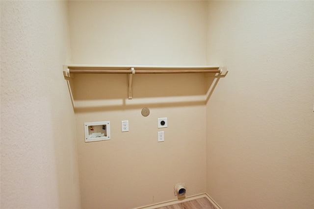 laundry room with hardwood / wood-style flooring, washer hookup, gas dryer hookup, and electric dryer hookup