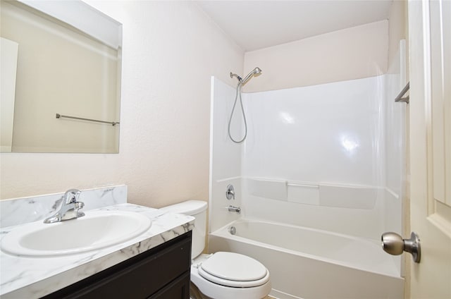 full bathroom with vanity, washtub / shower combination, and toilet